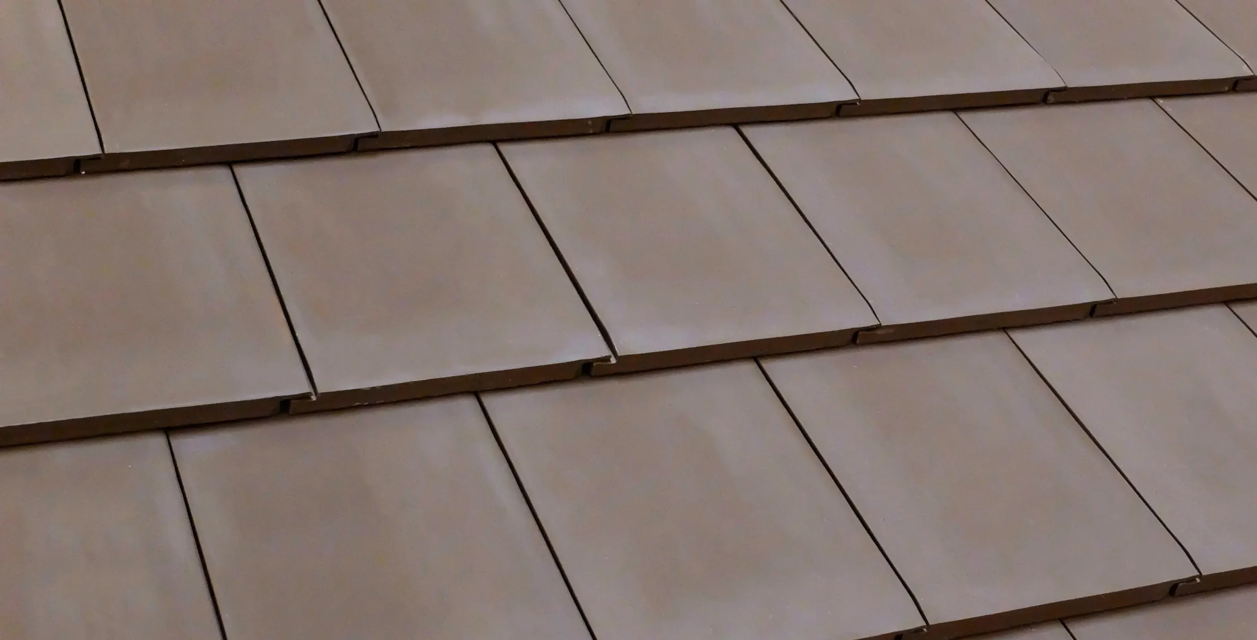 Brown ceramic roof tiles overlapping pattern