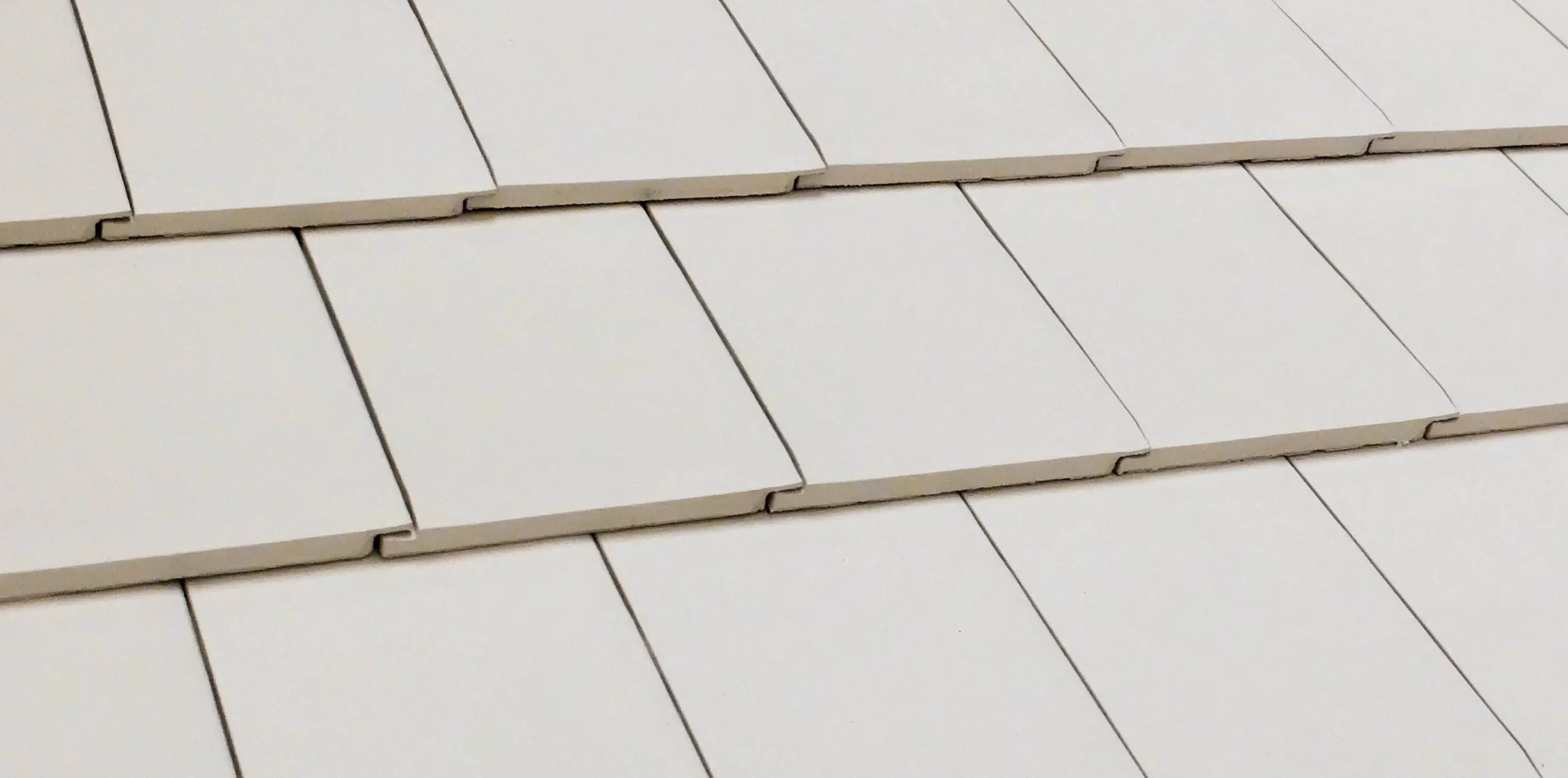 White ceramic roof tiles in rows