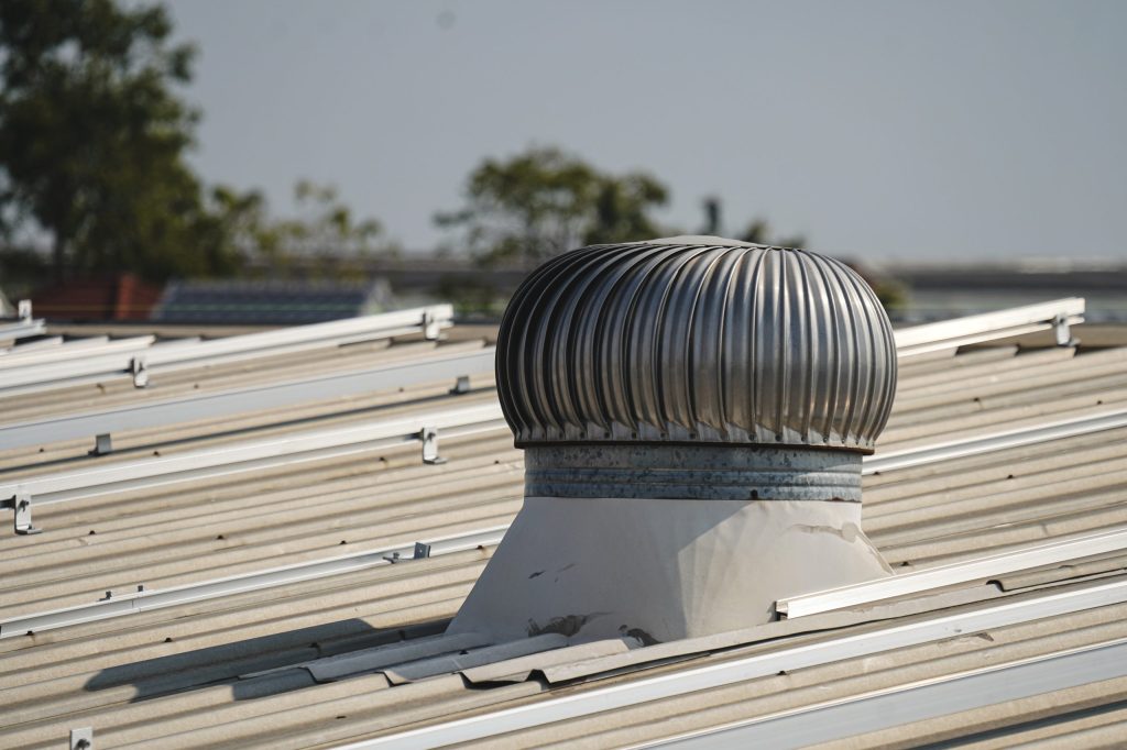 Metal turbine ventilator on industrial roof